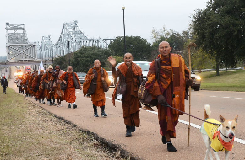Monks walking by the bridge with Aloka