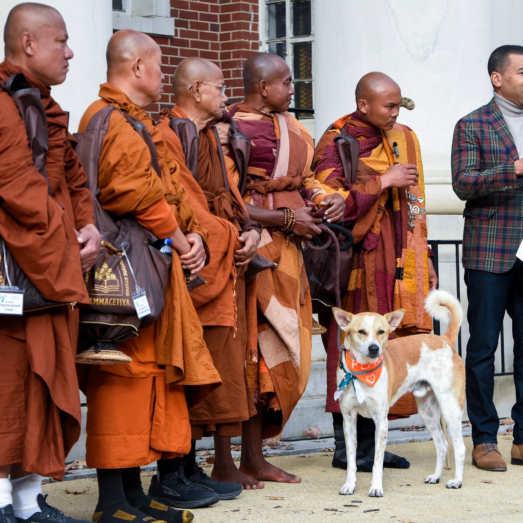 Aloka standing with the monks